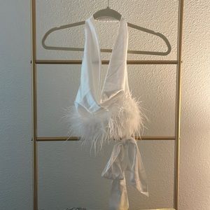 Going out, open back tied top. Sleek, breezy material with furr. Size Small.